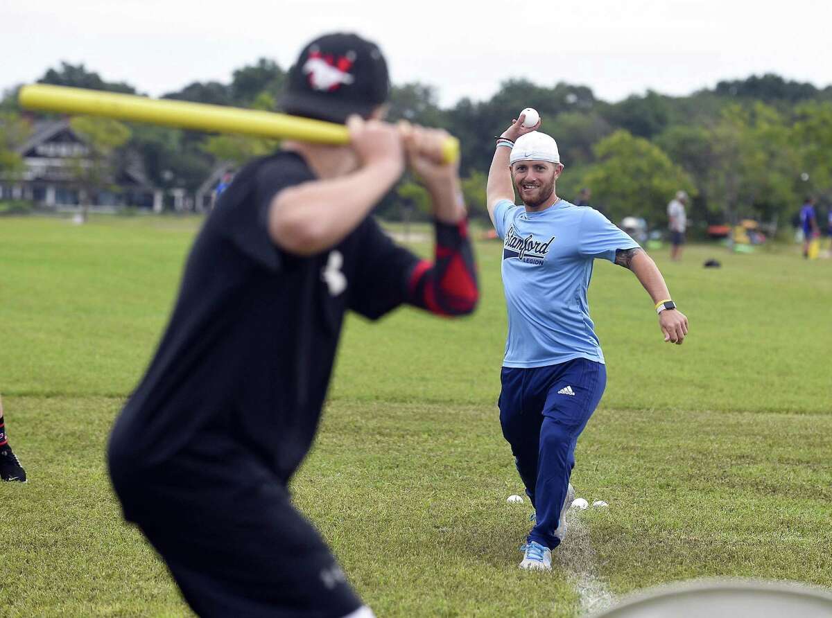 Stamford resident Mike Summa delivers a pitch during the inaugural Christopher Sabia Memorial Wiffle Ball Tournament at Cove Island Park in Stamford on Saturday, “Sabes” was a Stamford Legion baseball executive, coach and player for over two decades before he died from cancer last July at age 39. He was survived by his wife, Emma, and son, CJ.