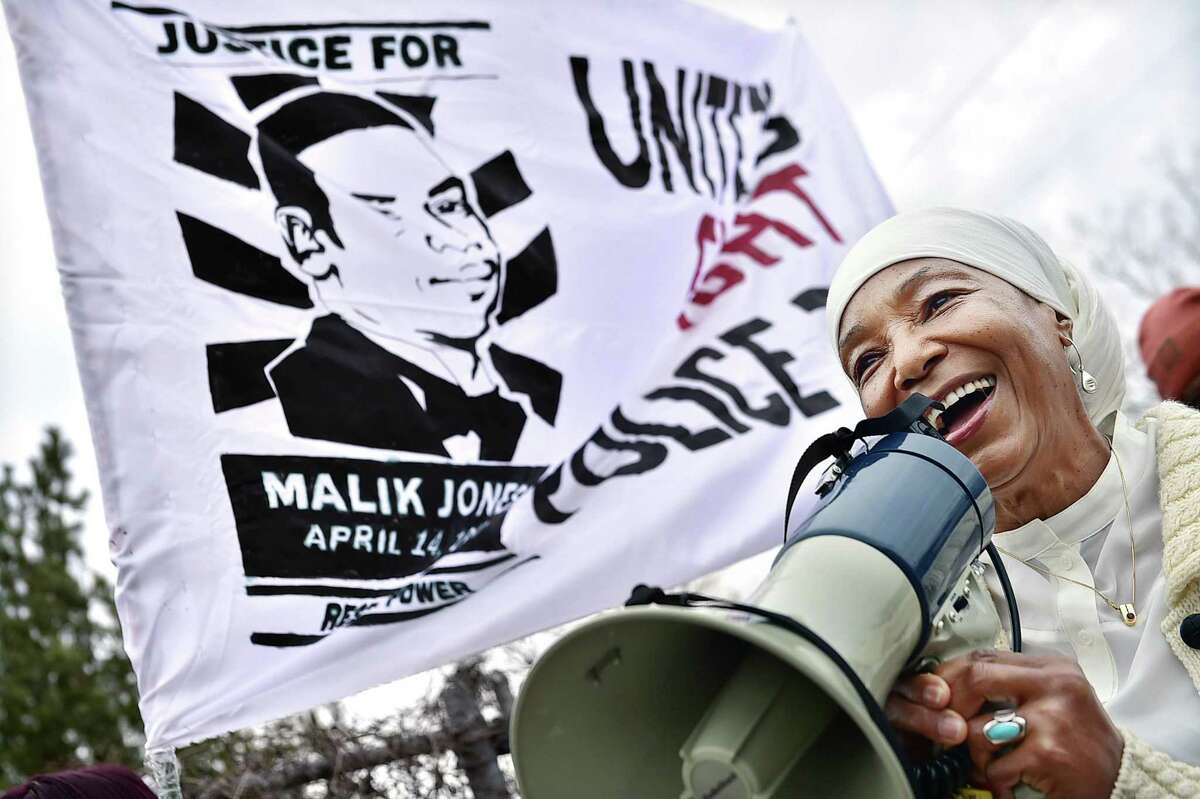 (Catherine Avalone - New Haven Register) New Haven resident, Emma Jones, smiles when she talks about her son, Malik Jones, while speaking to marchers at the "Rally Against Police Violence," on Grand Avenue in New Haven. On April 14, 1997, Malik Jones, 21, was shot by an East Haven police officer following a chase from East Haven to the city?’s Fair Haven section.