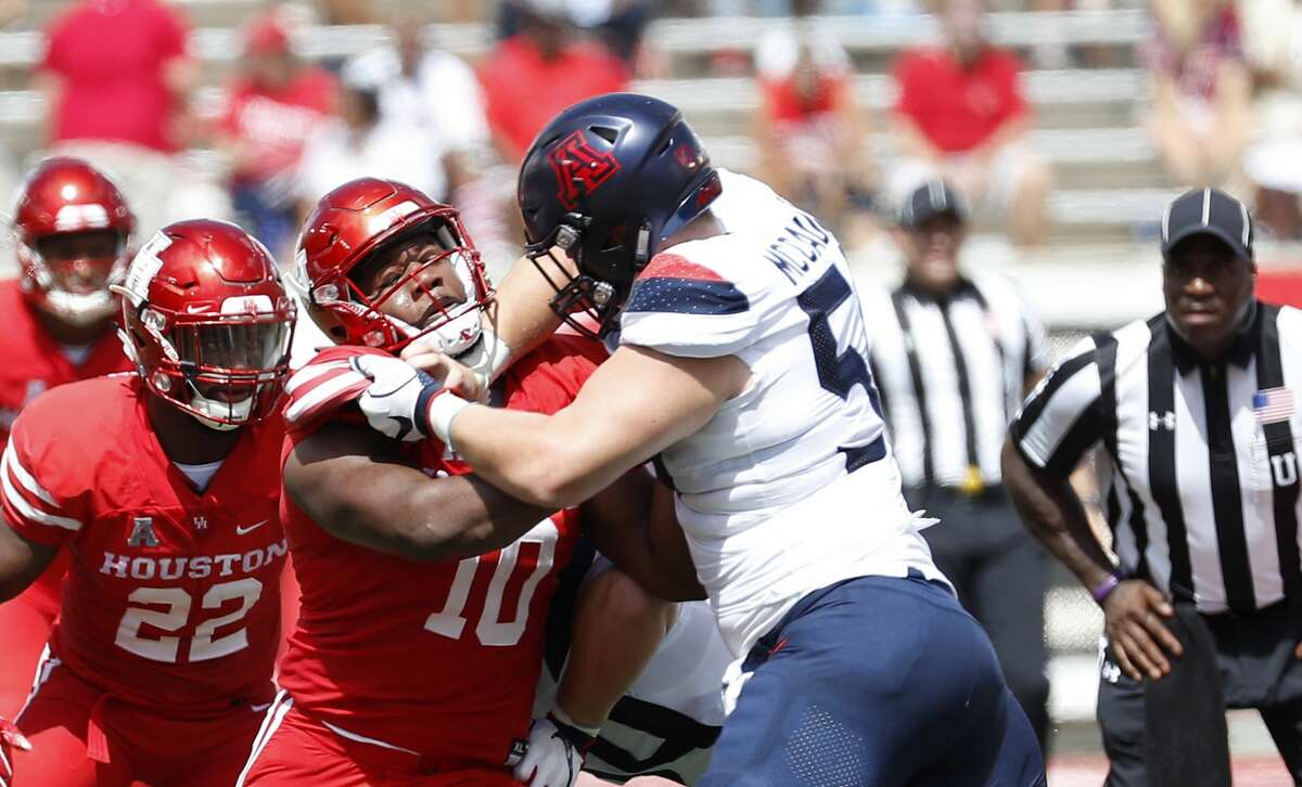 Houston Cougars defensive tackle Ed Oliver (10) works against Arizona Wildcats offensive lineman Josh McCauley (50) during the first half of a college football game at TDECU Stadium, Saturday, September 8, 2018, in Houston.