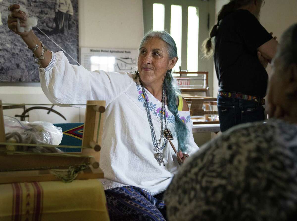 Christina Palafox uses a Navajo style spindle to spin wool into yarn, Saturday, Sept. 8, 2018, at Mission Espada in San Antonio. (Darren Abate/Contributor)