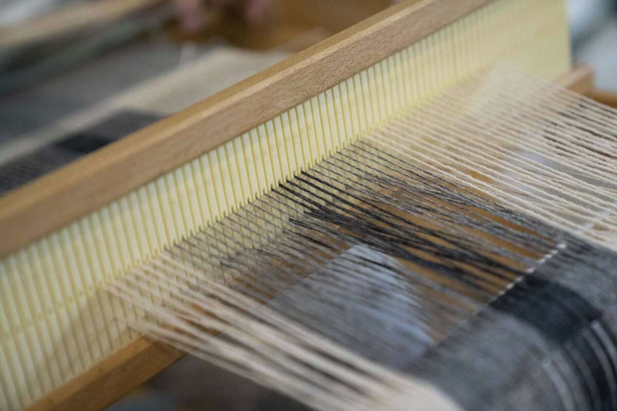 Visitors enjoy learning about hand weaving at San Antonio’s Mission Espada