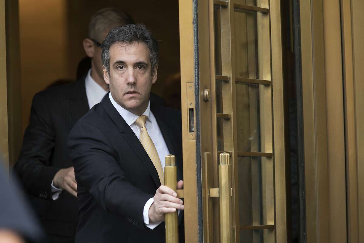FILE - In this Aug. 21, 2018, file photo, Michael Cohen leaves Federal court, in New York. Cohen's lawyer, Lanny Davis, is walking back his assertions that the president's former "fixer" could tell a special prosecutor that Trump had prior knowledge of a meeting with a Russian lawyer to get damaging information on Hillary Clinton. (AP Photo/Mary Altaffer, File)