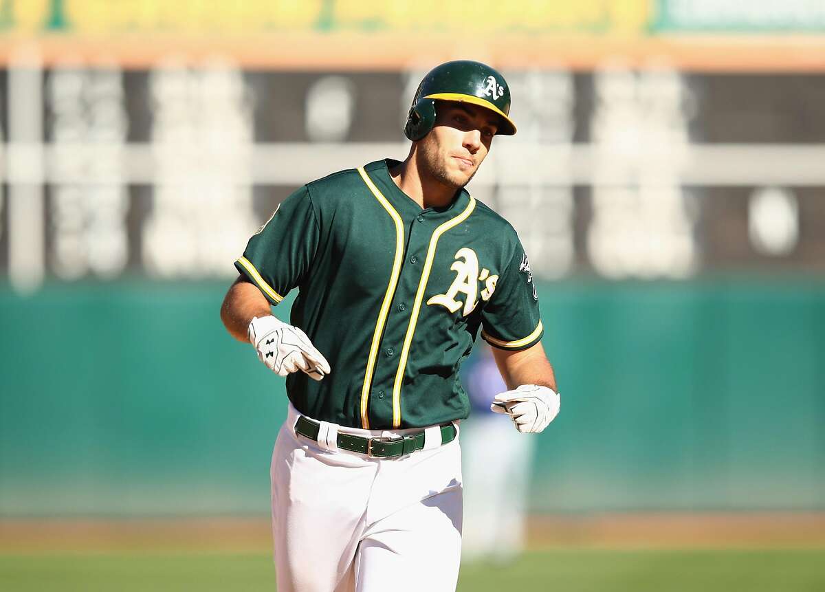 OAKLAND, CA - SEPTEMBER 08: Matt Olson #28 of the Oakland Athletics rounds the bases after hitting a home run in the eighth inning against the Texas Rangers at Oakland Alameda Coliseum on September 8, 2018 in Oakland, California. (Photo by Ezra Shaw/Getty Images)