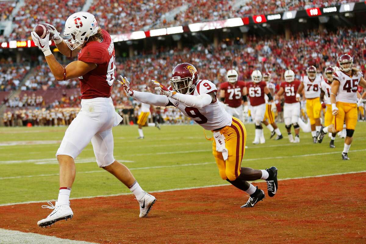 Stanford Cardinal tight end Colby Parkinson (84) makes the touchdown catch against USC Trojans cornerback Greg Johnson (9) during the second quarter of an NCAA football game between Stanford Cardinal and USC Trojans at Stanford Stadium, Saturday, Sept. 8, 2018, in Stanford, Calif.