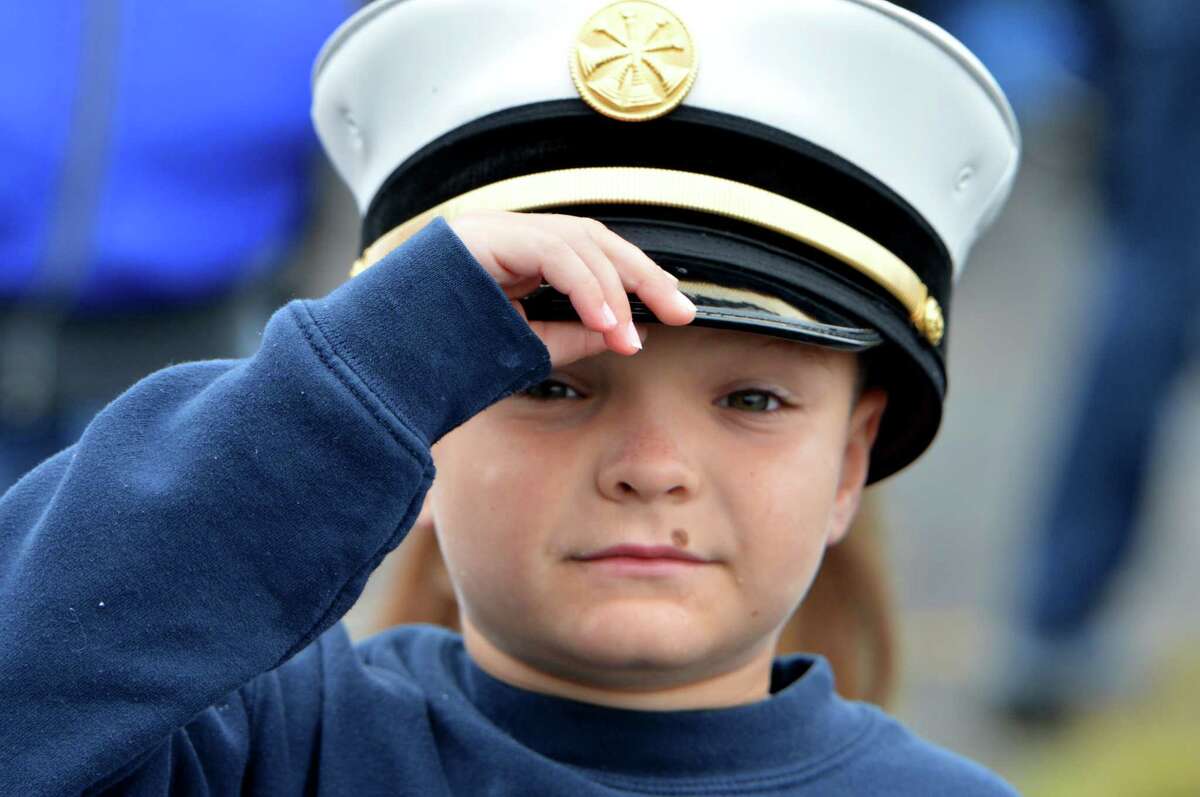 Norwalk's 7 year-old Mason King wears his fathers Assistant Fire Chief's hat during the start the 18th Annual CT United Ride at Norden Park on Sunday September 9, 2018 in Norwalk Conn. Almost 2,000 motorcycle riders took part in Connecticut's largest annual 9/11 tribute riding from Norwalk through Fairfield County to Bridgeport's Seaside Park