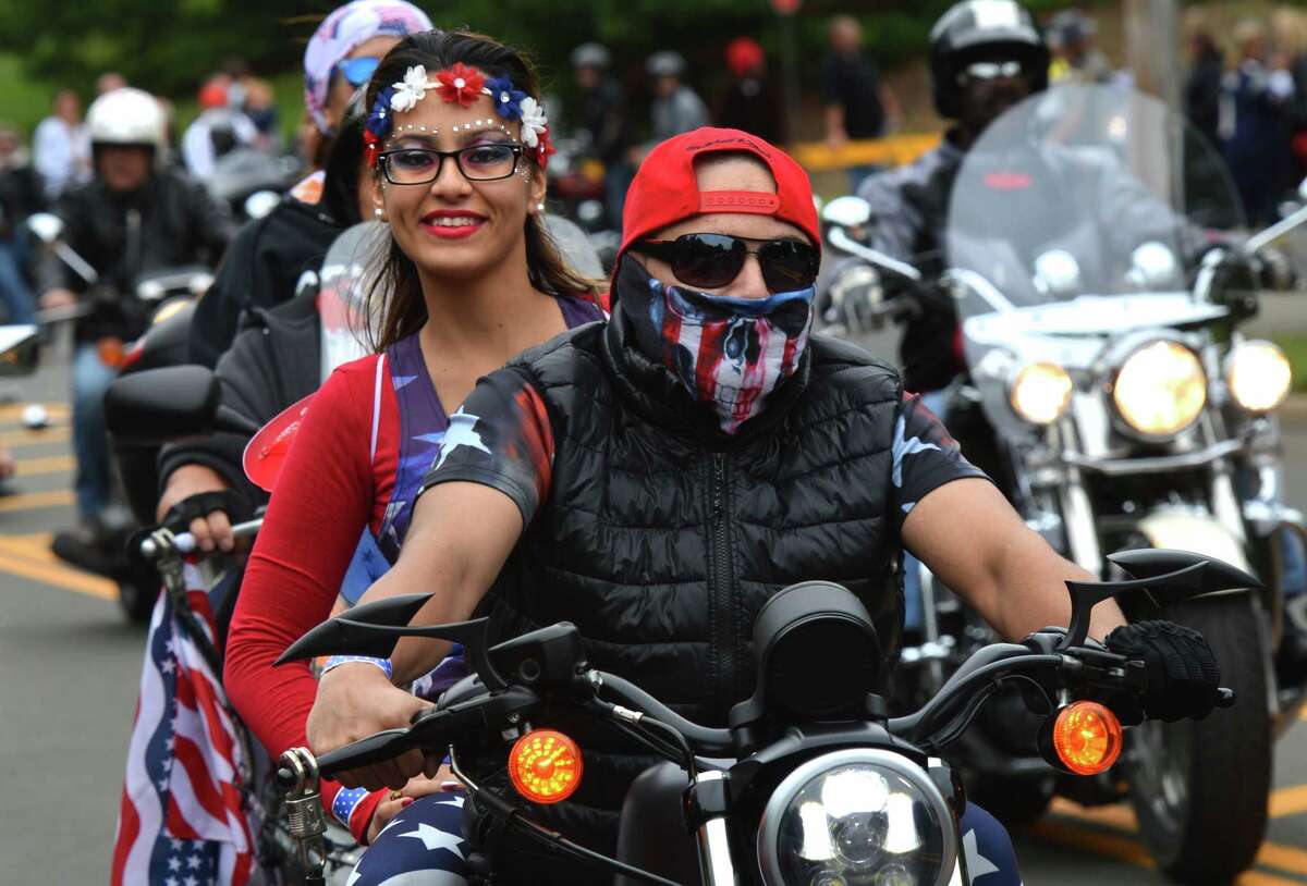 Bridgeport's Julissa Delon rides with Waldy Rodriguez at the start the 18th Annual CT United Ride at Norden Park on Sunday September 9, 2018 in Norwalk Conn. Almost 2,000 motorcycle riders took part in Connecticut's largest annual 9/11 tribute riding from Norwalk through Fairfield County to Bridgeport's Seaside Park