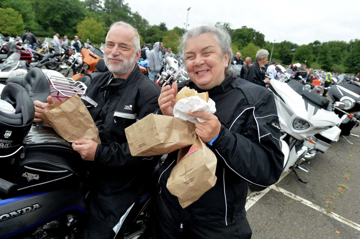 Trumbull's Keith Murphy and Diane Croll get energized on coffee and breakfast sandwiches before the start the 18th Annual CT United Ride at Norden Park on Sunday September 9, 2018 in Norwalk Conn. Almost 2,000 motorcycle riders took part in Connecticut's largest annual 9/11 tribute riding from Norwalk through Fairfield County to Bridgeport's Seaside Park