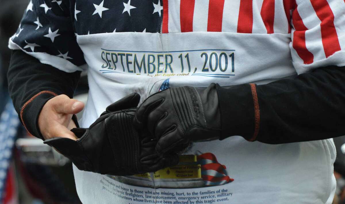 Gloves go on for warmth on a cool day for the start the 18th Annual CT United Ride at Norden Park on Sunday September 9, 2018 in Norwalk Conn. Almost 2,000 motorcycle riders took part in Connecticut's largest annual 9/11 tribute riding from Norwalk through Fairfield County to Bridgeport's Seaside Park