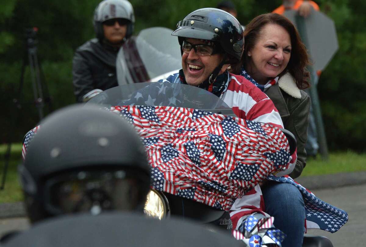 Riders pass under the American flag at the start the 18th Annual CT United Ride at Norden Park on Sunday September 9, 2018 in Norwalk Conn. Almost 2,000 motorcycle riders took part in Connecticut's largest annual 9/11 tribute riding from Norwalk through Fairfield County to Bridgeport's Seaside Park