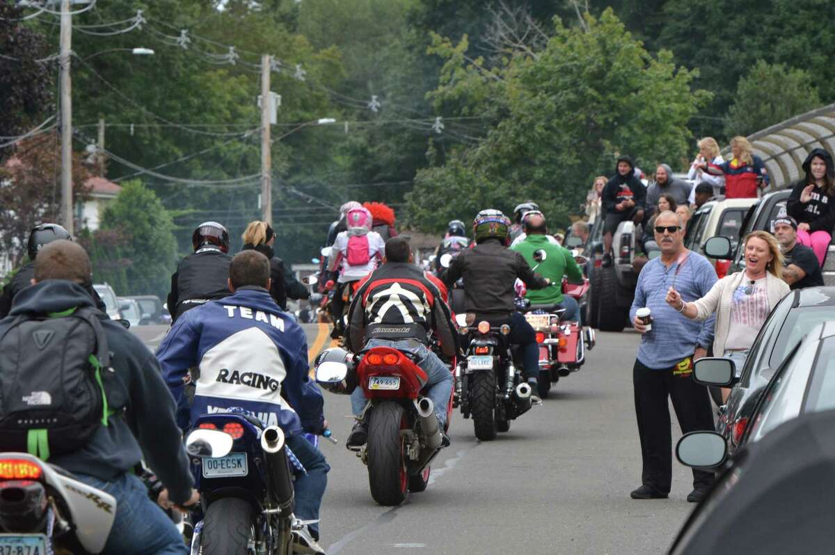 Riders pass under the American flag at the start the 18th Annual CT United Ride at Norden Park on Sunday September 9, 2018 in Norwalk Conn. Almost 2,000 motorcycle riders took part in Connecticut's largest annual 9/11 tribute riding from Norwalk through Fairfield County to Bridgeport's Seaside Park