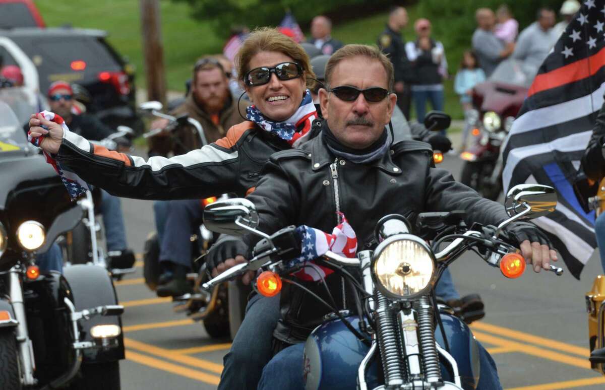 Riders pass under the American flag at the start the 18th Annual CT United Ride at Norden Park on Sunday September 9, 2018 in Norwalk Conn. Almost 2,000 motorcycle riders took part in Connecticut's largest annual 9/11 tribute riding from Norwalk through Fairfield County to Bridgeport's Seaside Park
