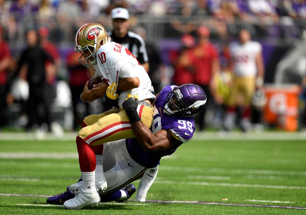 Danielle Hunter #99 of the Minnesota Vikings sacks Jimmy Garoppolo #10 of the San Francisco 49ers in the second half of the game at U.S. Bank Stadium on September 9, 2018 in Minneapolis, Minnesota. (Photo by Hannah Foslien/Getty Images)