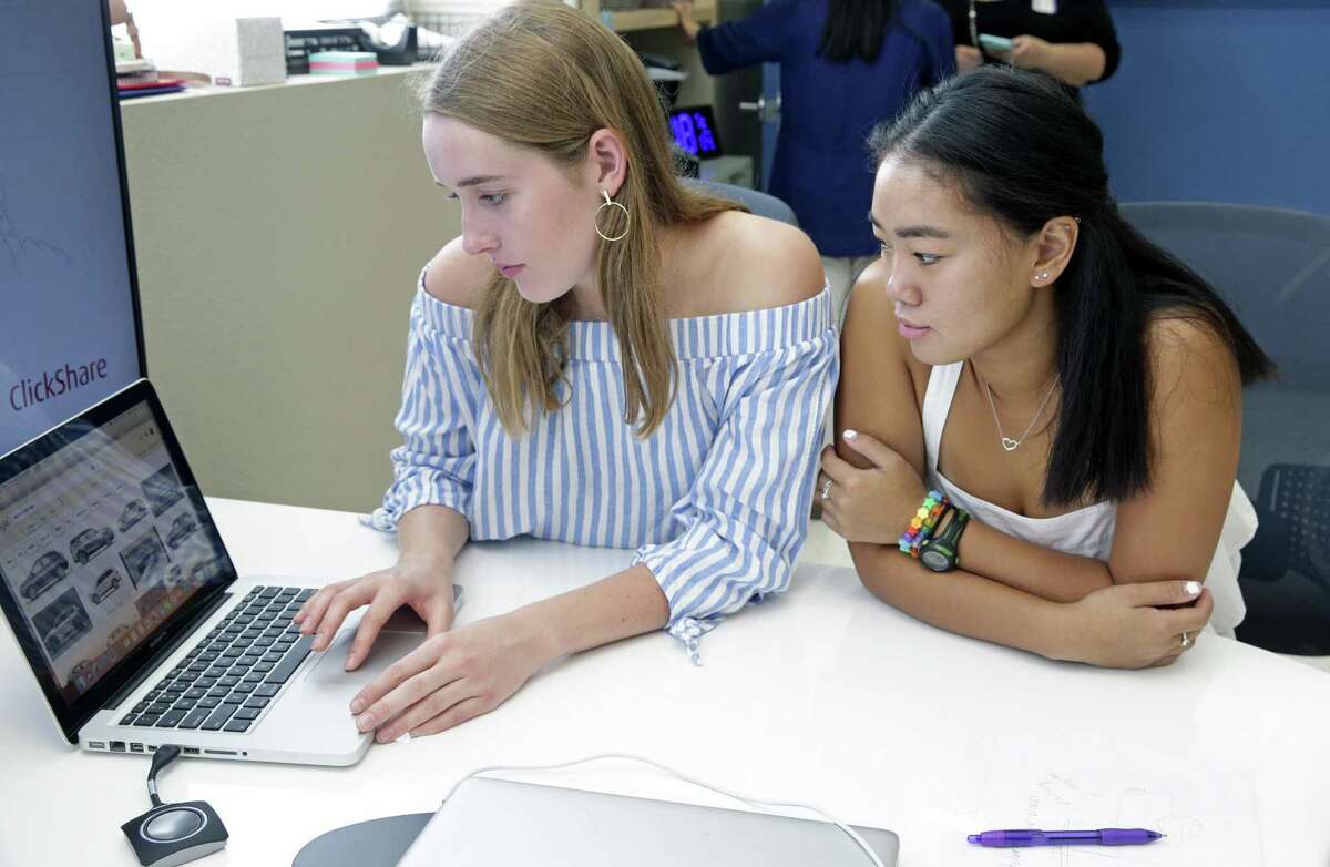 Helen Hunter (left) and Mia McEwen check the internet for ideas as Alamo Heights students participate in a class called Business Incubator wherein groups work on a business presentation and present it to real business people visiting the school on September 5, 2018.