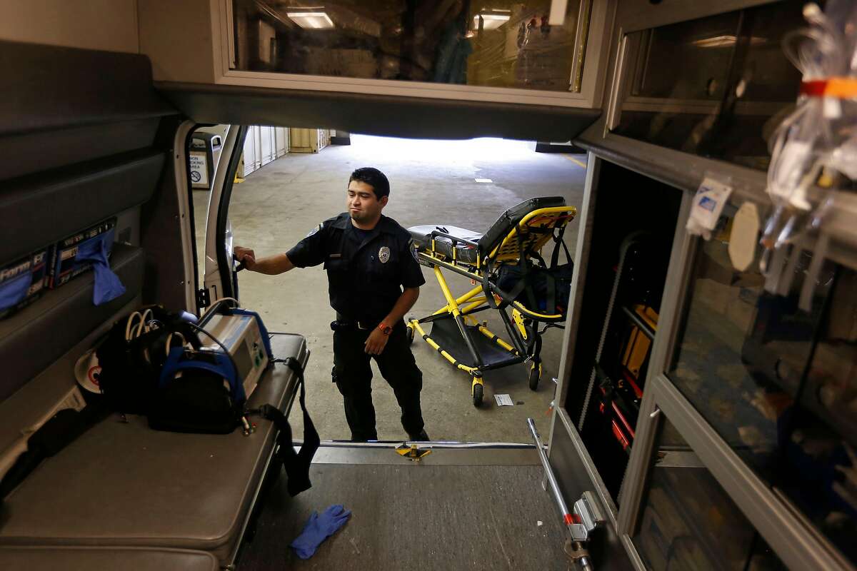 Paramedic Cory Yeo with the King-American Ambulance company, preps their ambulance at the California Pacific Medical Center, after a medical call, in San Francisco, Calif., on Thursday 12, 2014. A report by the San Francisco Supervisor's budget analyst reports the city needs to increase its ambulance staffing, improve its emergency system coordination and 911 dispatch system and replace it's aging ambulance fleet.