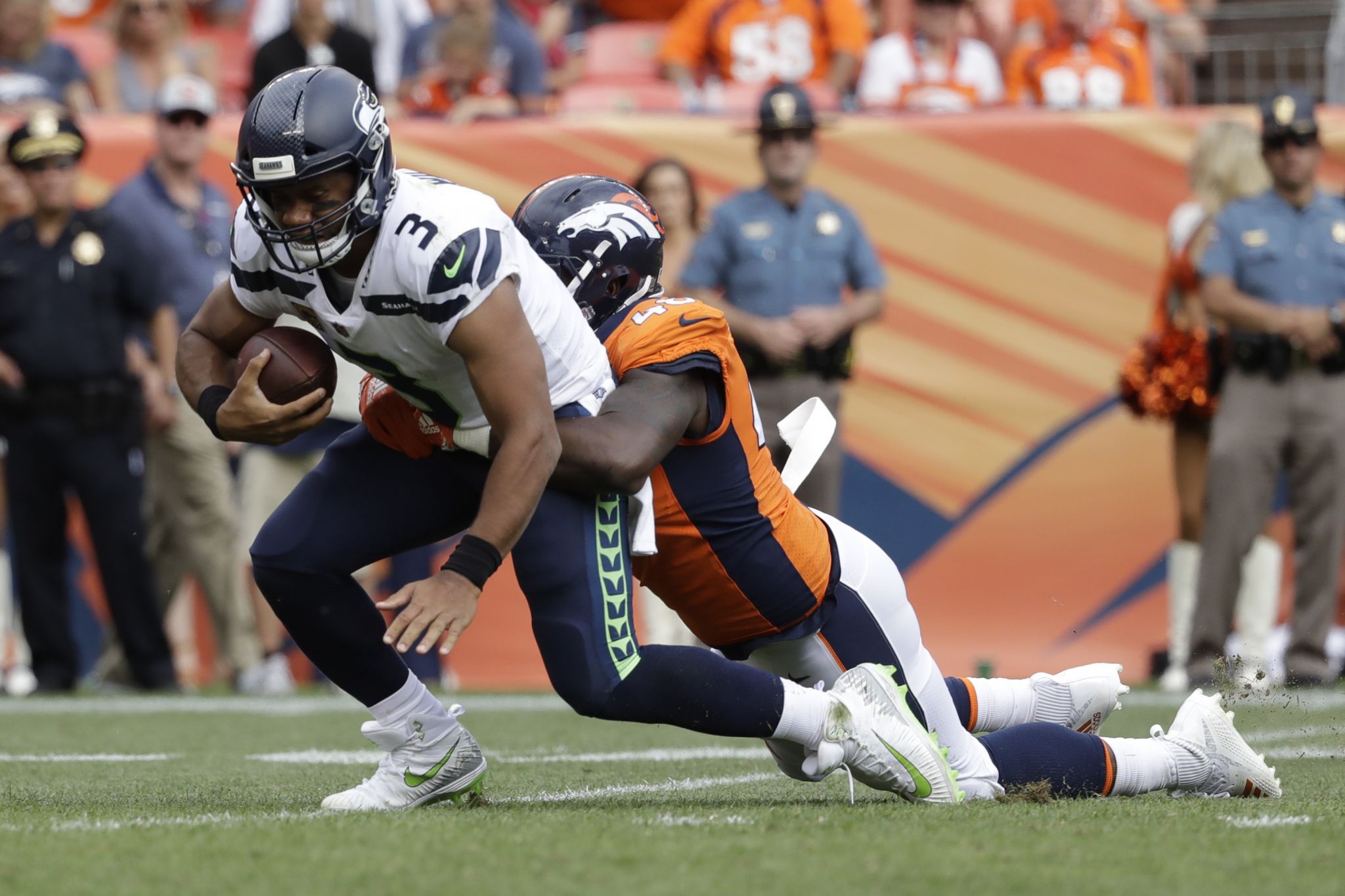 The Denver Broncos and the Seattle Seahawks line up on the line of  scrimmage during the first half of an NFL football game Sunday, Sept. 9,  2018, in Denver. (AP Photo/Jack Dempsey