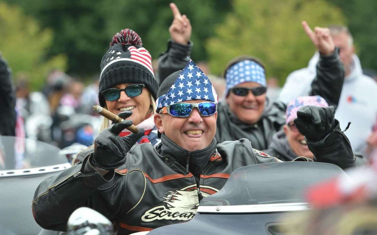 Milford's Erik Schmailing and wife Marcela get excited as riders start their motorcycles during the start the 18th Annual CT United Ride at Norden Park on Sunday September 9, 2018 in Norwalk Conn. Almost 2,000 motorcycle riders took part in Connecticut's largest annual 9/11 tribute riding from Norwalk through Fairfield County to Bridgeport's Seaside Park