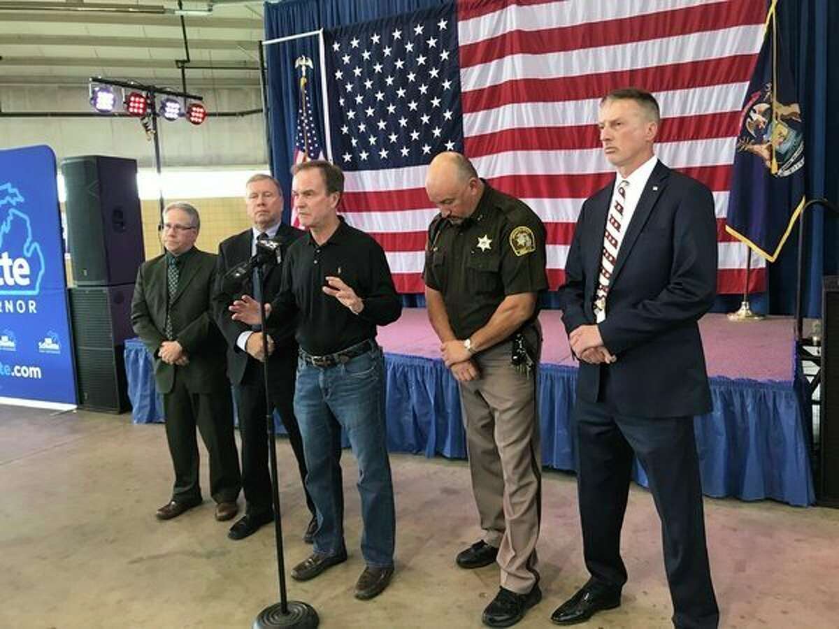 Michigan Attorney General and Republican gubernatorial nominee Bill Schuette speaks during a press conference Monday at the Midland County Fairgrounds with local Republican law enforcement officials to 'issue a public safety warning' against his Democratic opponent's stance on immigration. (Kate Carlson/kcarlson@mdn.net)
