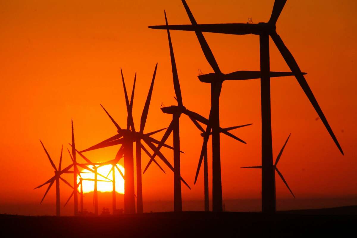 A sunrise view is seen at EDF Renewable field of gigantic wind turbines, which stand nearly 300 feet high near Rio Vista, California, September 24, 2012. (Bob Chamberlin/Los Angeles Times/MCT)