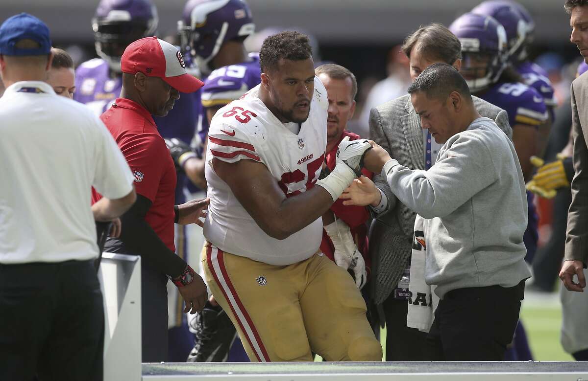 San Francisco 49ers offensive guard Joshua Garnett is helped off the field after getting injured during the second half of an NFL football game against the Minnesota Vikings, Sunday, Sept. 9, 2018, in Minneapolis. (AP Photo/Jim Mone)