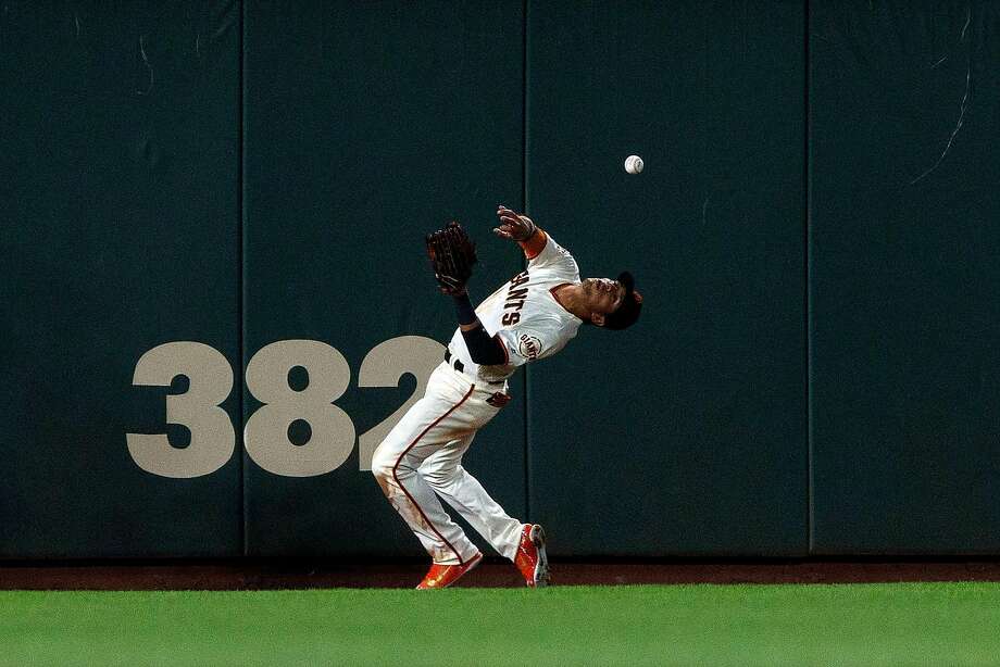 7 of the san francisco giants is unable to field a ball hit for