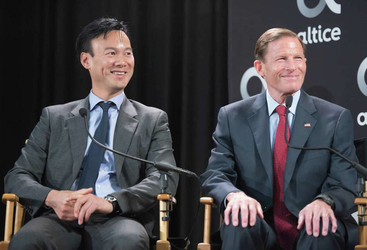 Altice USA CEO Dexter Goei, left, in May 2018 alongside U.S. Sen. Richard Blumenthal (D-Conn.), in Stamford, Conn.