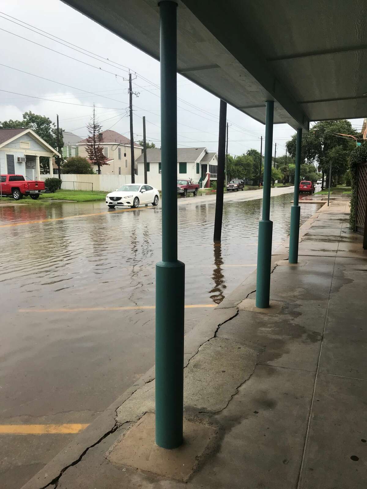 Cars navigate flooding Sept. 11, 2018 at 39th Street and Avenue O in Galveston.