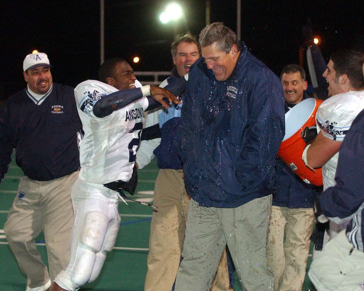 Ansonia High School football coach Jack Hunt gets doused with water at the end of his teams victory over Cromwell in the 2003 Class S State championship game. On Friday, the practice field at Jarvis Field in Ansonia will officially be named the Jack Hunt Memorial Practice Field.