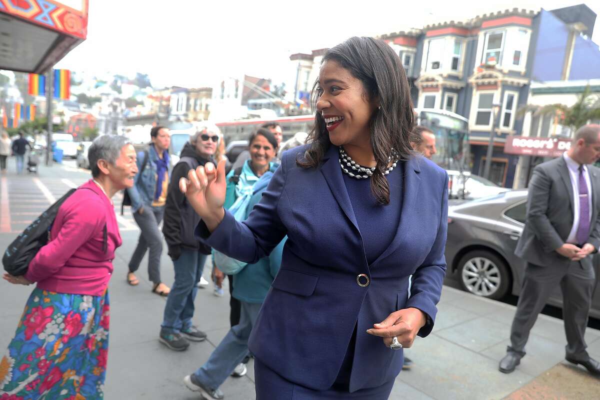 SF Mayor London Breed (right) talks with people in front of the Castro theatre as she takes a walk this morning around the Castro on Monday, Aug. 13, 2018 in San Francisco, Calif.