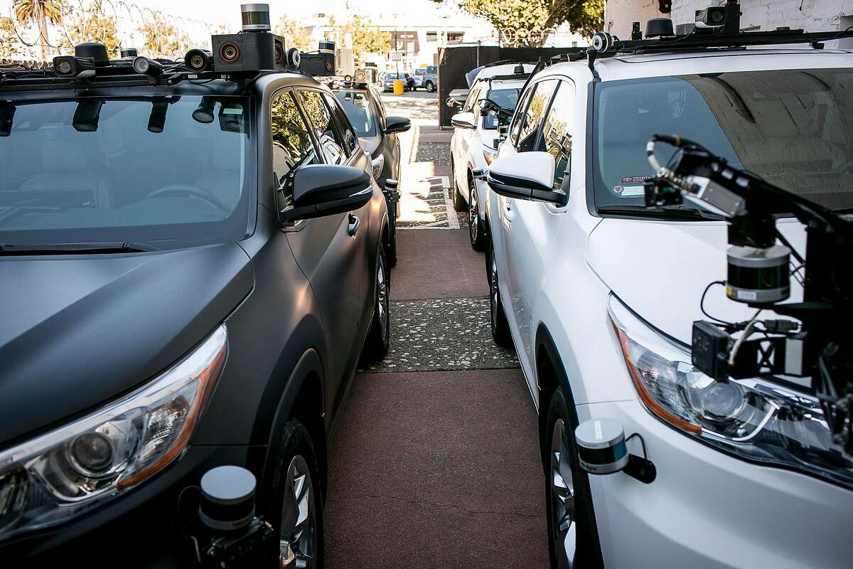 A fleet of Zoox autonomous cars are parked in a lot behind a Zoox office on Friday, Sept. 7, 2018 in San Francisco, Calif.