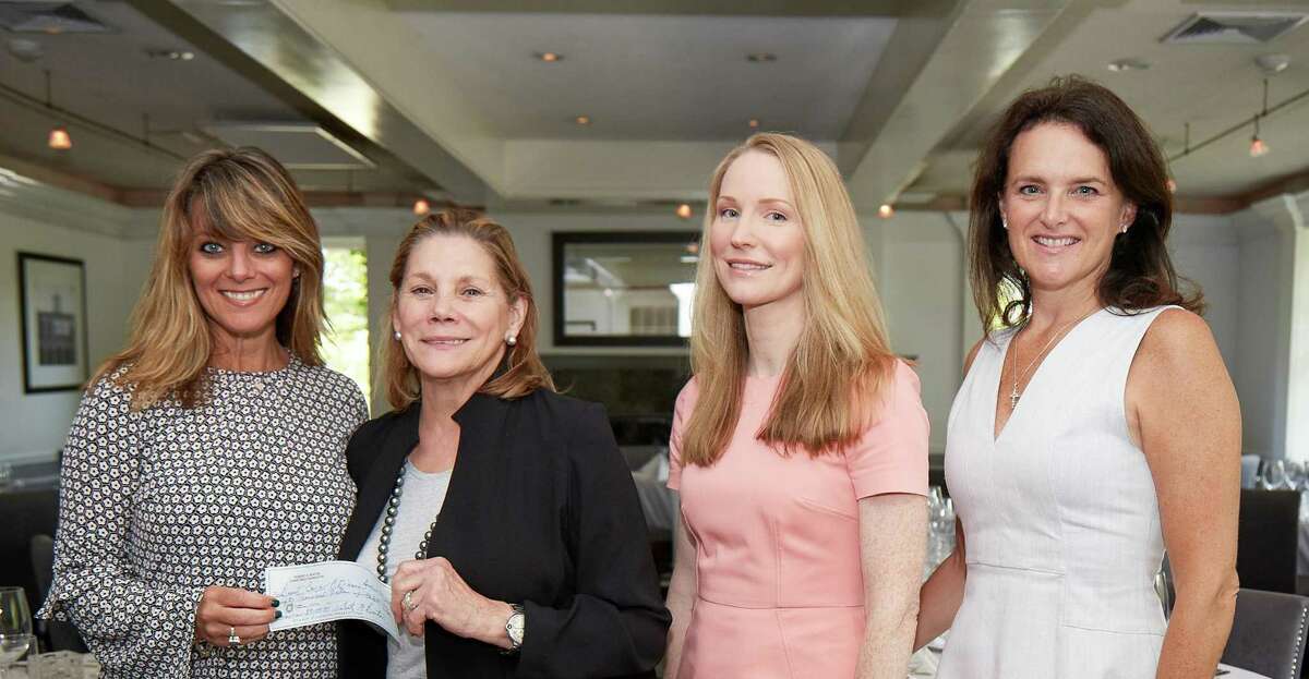 The Burton family not only made good on a promise to donate $1 million to the Greenwich based Breast Cancer Alliance they have exceeded their pledge. Last week, BCA Executive Director Yonni Wattenmaker, at left, was given a $50,000 check by Paula Burton, to her right, as they were joined by Calico Burton and BCA Board of Directors President Mary Jeffery.