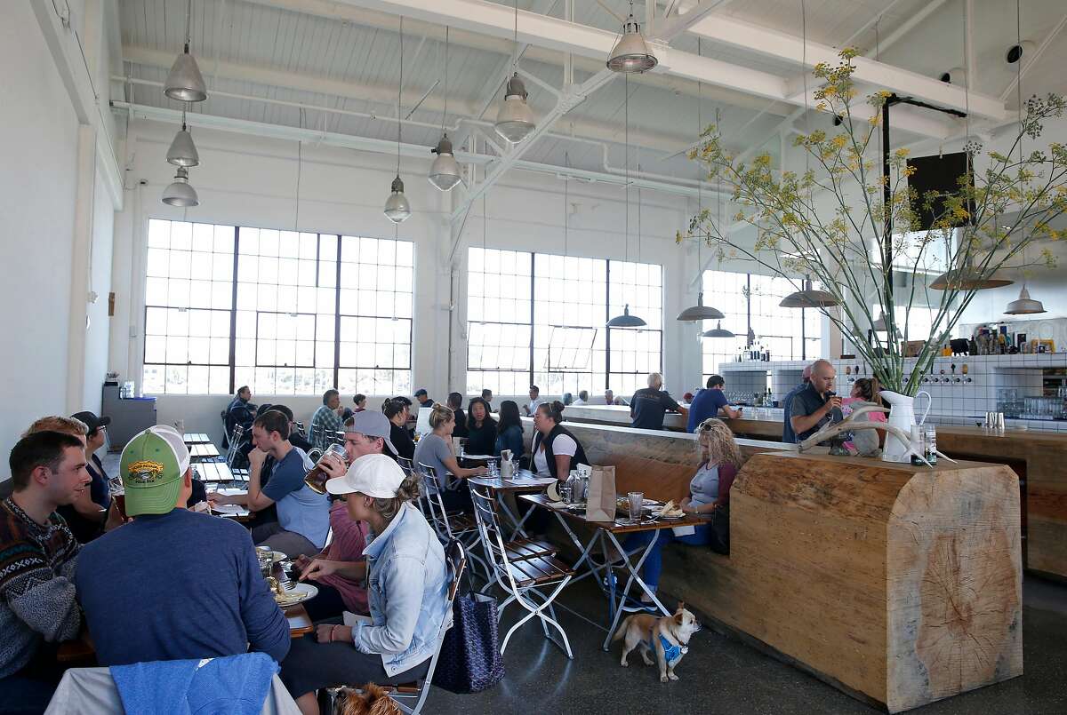 Diners enjoy food and beverages at Radhaus beer hall at Fort Mason in San Francisco, Calif. on Saturday, Sept. 8, 2018.