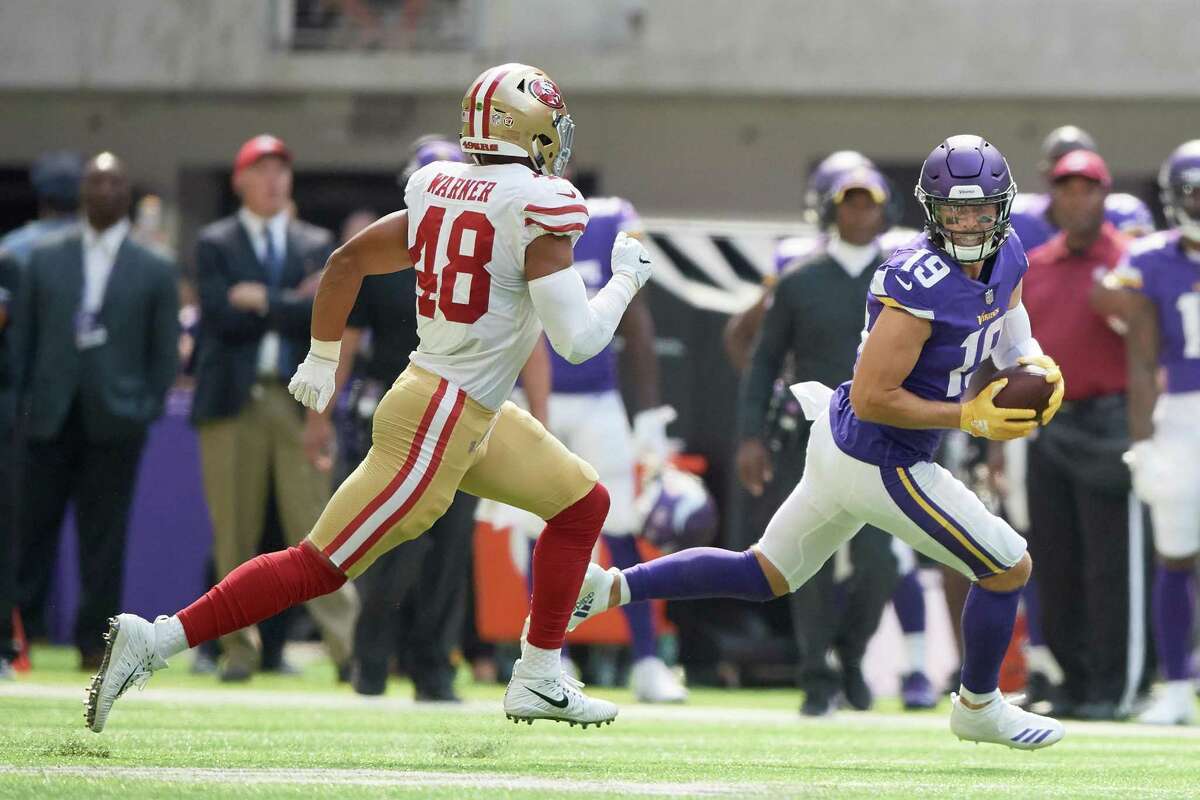 MINNEAPOLIS, MN - SEPTEMBER 09: Adam Thielen #19 of the Minnesota Vikings carries the ball after a reception against Fred Warner #48 of the San Francisco 49ers during the game on September 9, 2018 at U.S. Bank Stadium in Minneapolis, Minnesota. The Vikings defeated the 49ers 24-16. (Photo by Hannah Foslien/Getty Images)