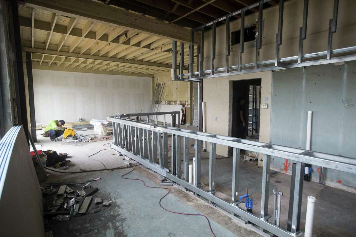 Construction continues on the the former Montalbano Tire Center, that is being redeveloped by Andrew Kaldis, on Tuesday, Sept. 11, 2018, in Houston. Kaldis, a Houston developer known for quirky inner-loop projects, is redeveloping the location into a multipurpose space, that will include a bar and a yoga studio.