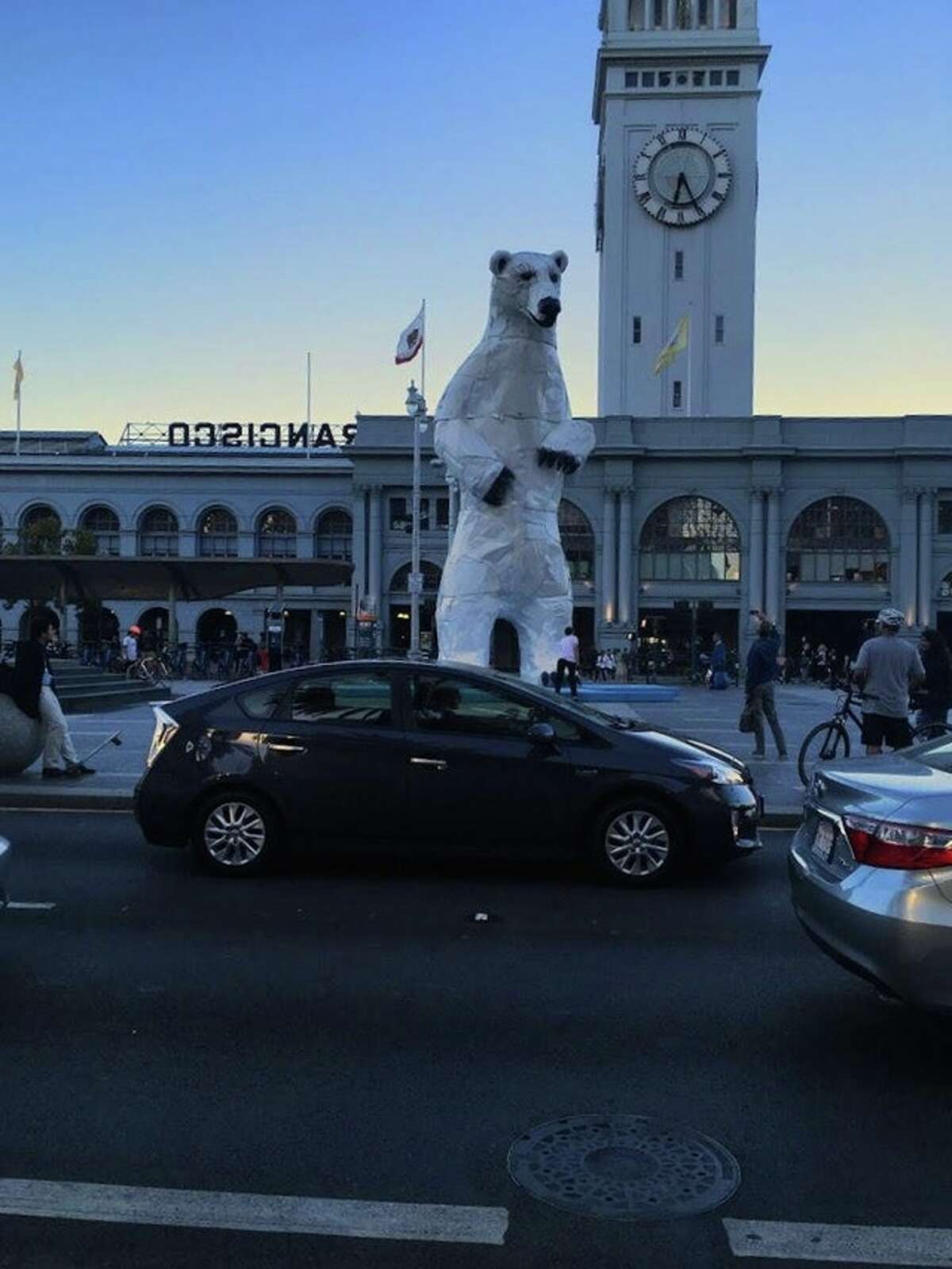 A 35-foot-tall polar bear sculpture made from car hoods looms tall in front of the San Francisco Ferry Building during the Global Climate Action Summit, September 2018.
