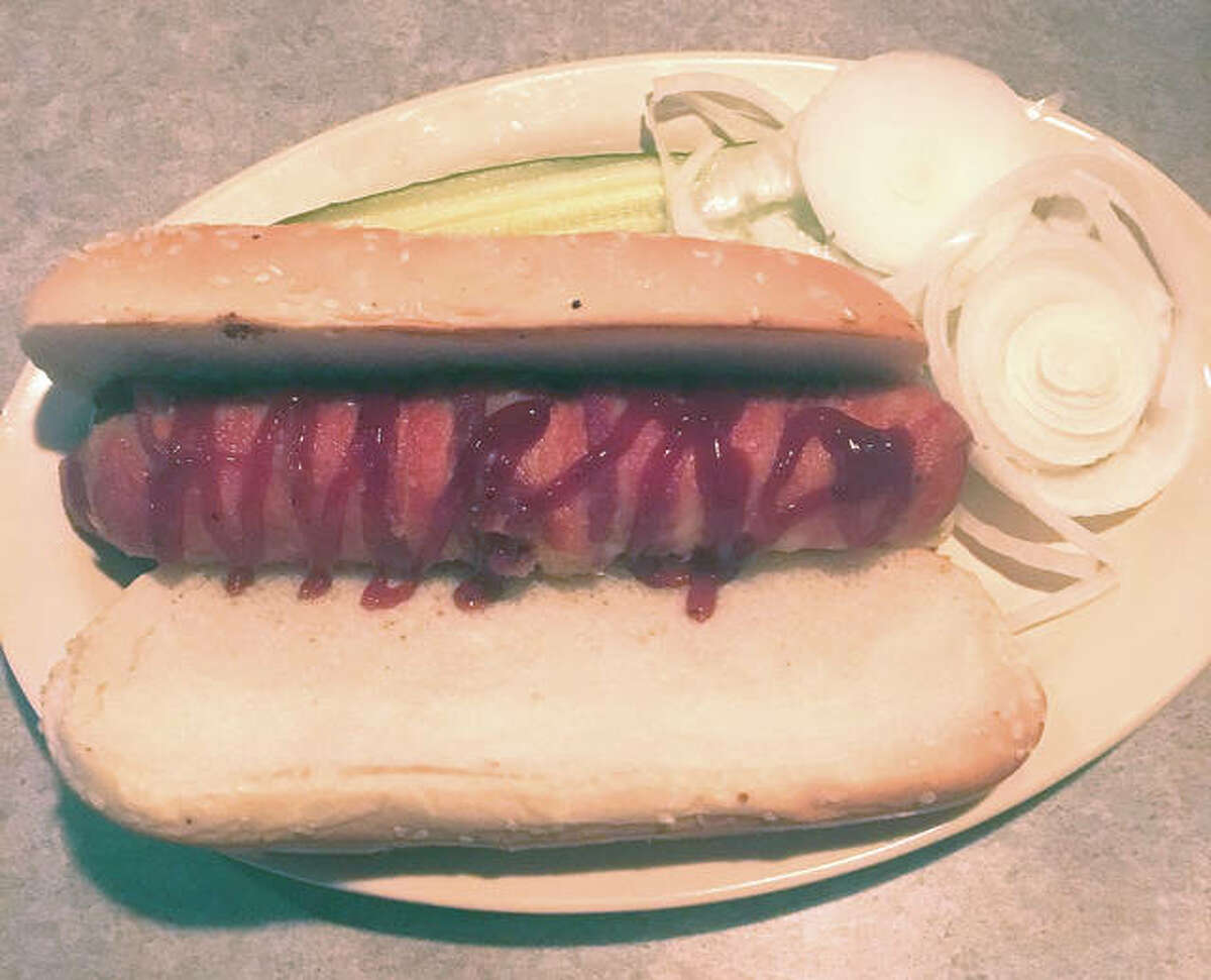 The toothpick from Hodak’s Restaurant and Bar at 2100 Gravois Ave. in St. Louis. It consists of a split beef hot dog stuffed with mozzarella cheese, wrapped in bacon and served on a hoagie.