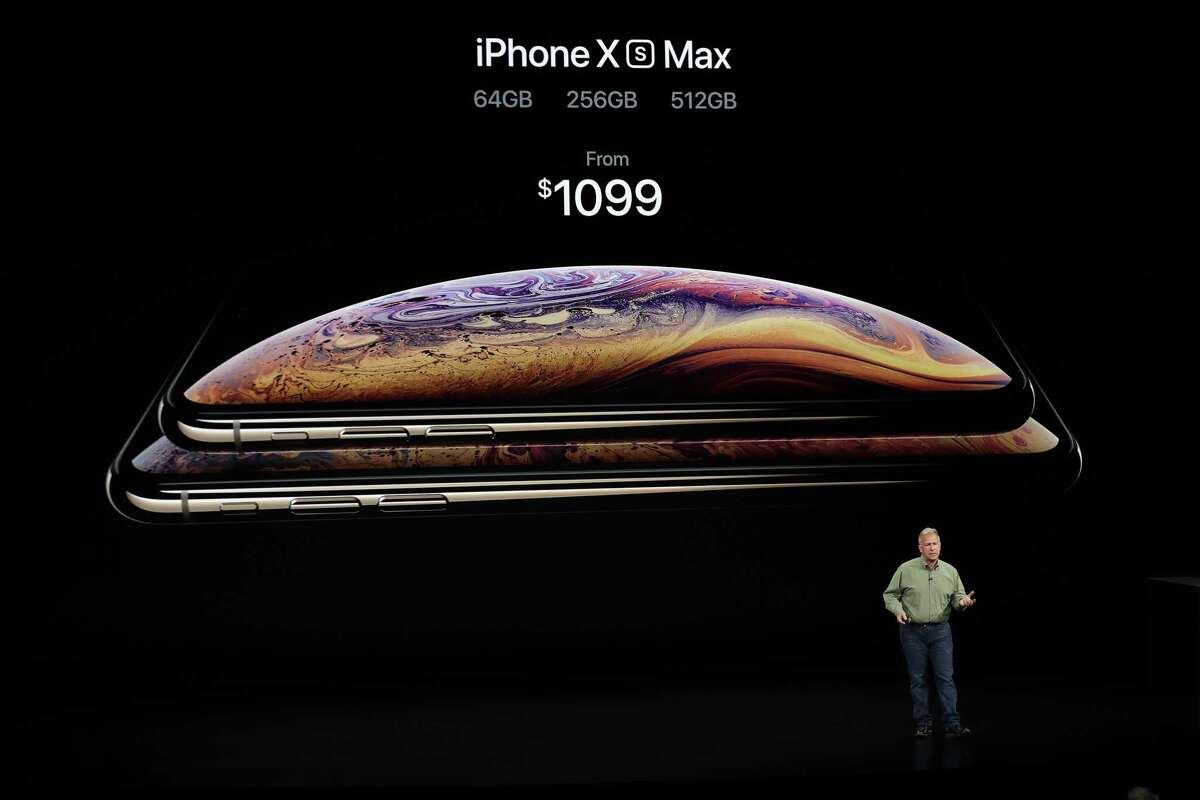 Phil Schiller, Apple's senior vice president of worldwide marketing, shows the pricing of the new iPhone Xs Max during an event to announce new products Wednesday, Sept. 12, 2018, in Cupertino, Calif.