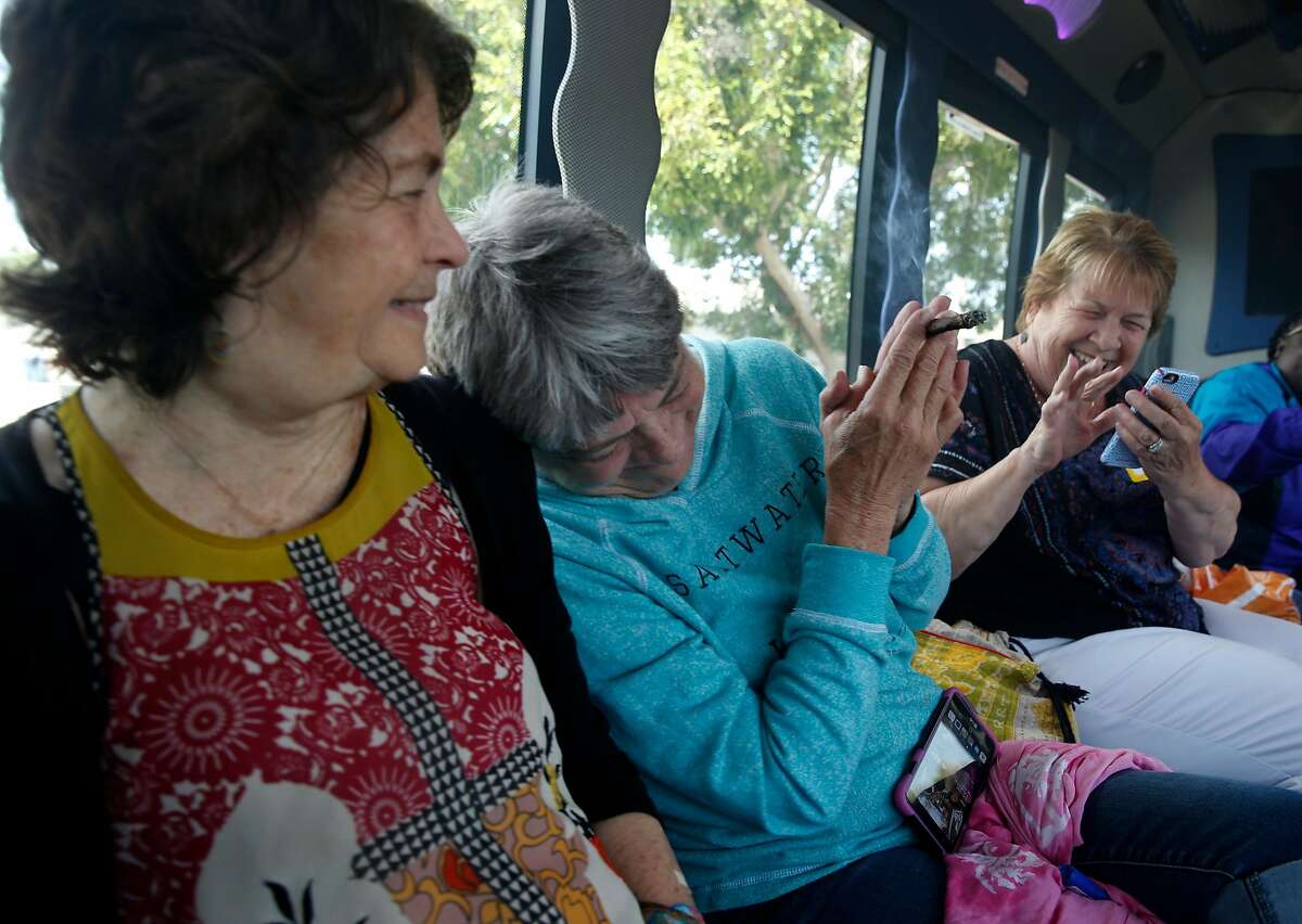 Sisters Henrietta Dills, Mary Atkins and Lori Probst share a joint as they head for the next stop on their tour, the Riggers Loft Wine Co., on the Weed & Wine  Tour.