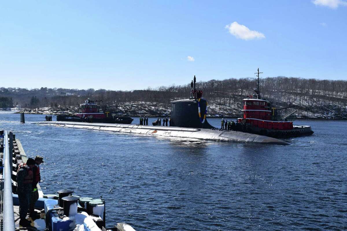 The USS Minnesota makes its way to the pier at Naval Submarine Base New London in Groton in March. An upcoming summit not far from the base will try to establish closer ties between the state companies and Australia.
