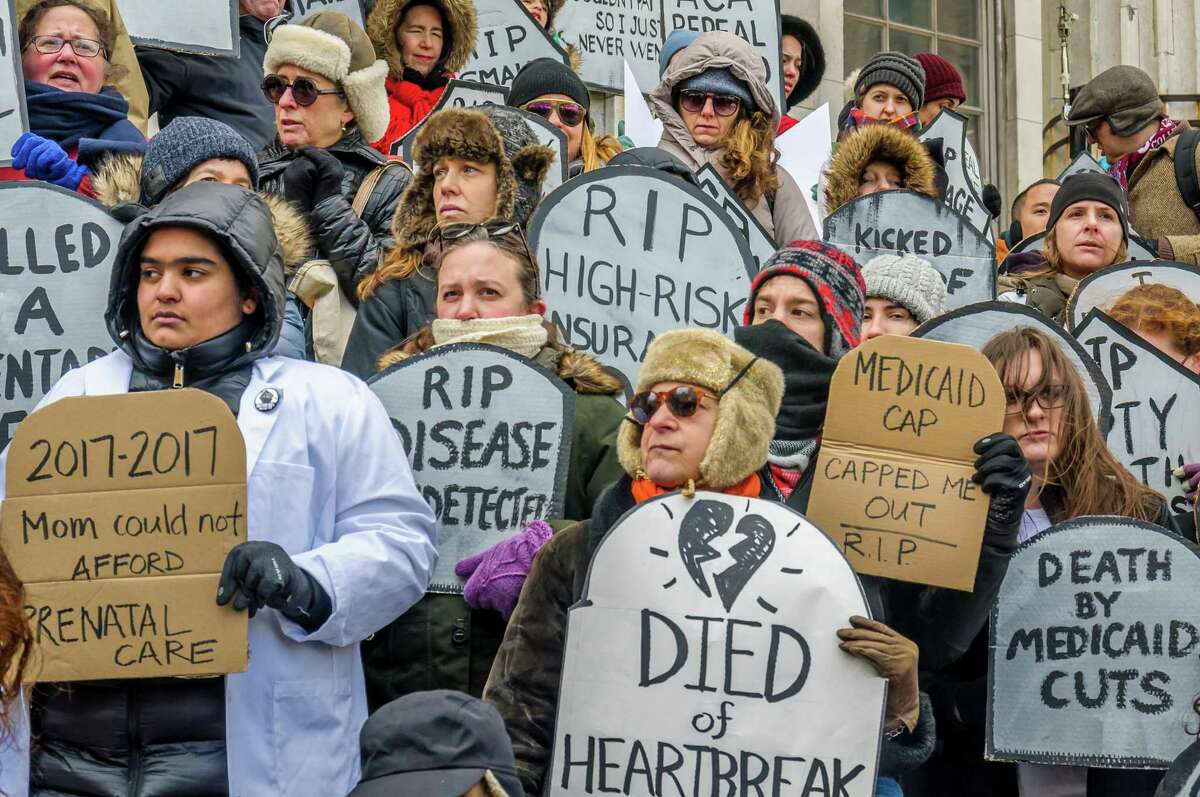People hold a rally to protest the Republican health care bill on March 11, 2017, in New York City. A new study finds that the repeal of pre-existing condition protections could affect more than 100 million people. (Erik Mcgregor/Pacific Press/Zuma Press/TNS)