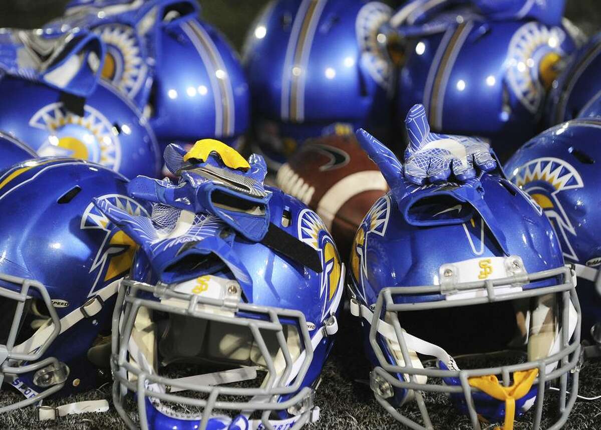 October 15, 2016: Helmets from San Jose State Spartans football players sit on the field during warm ups before the start of a NCAA football game between the University of Nevada Wolfpack and the San Jose State Spartans at CEFCU Stadium in San Jose, CA.