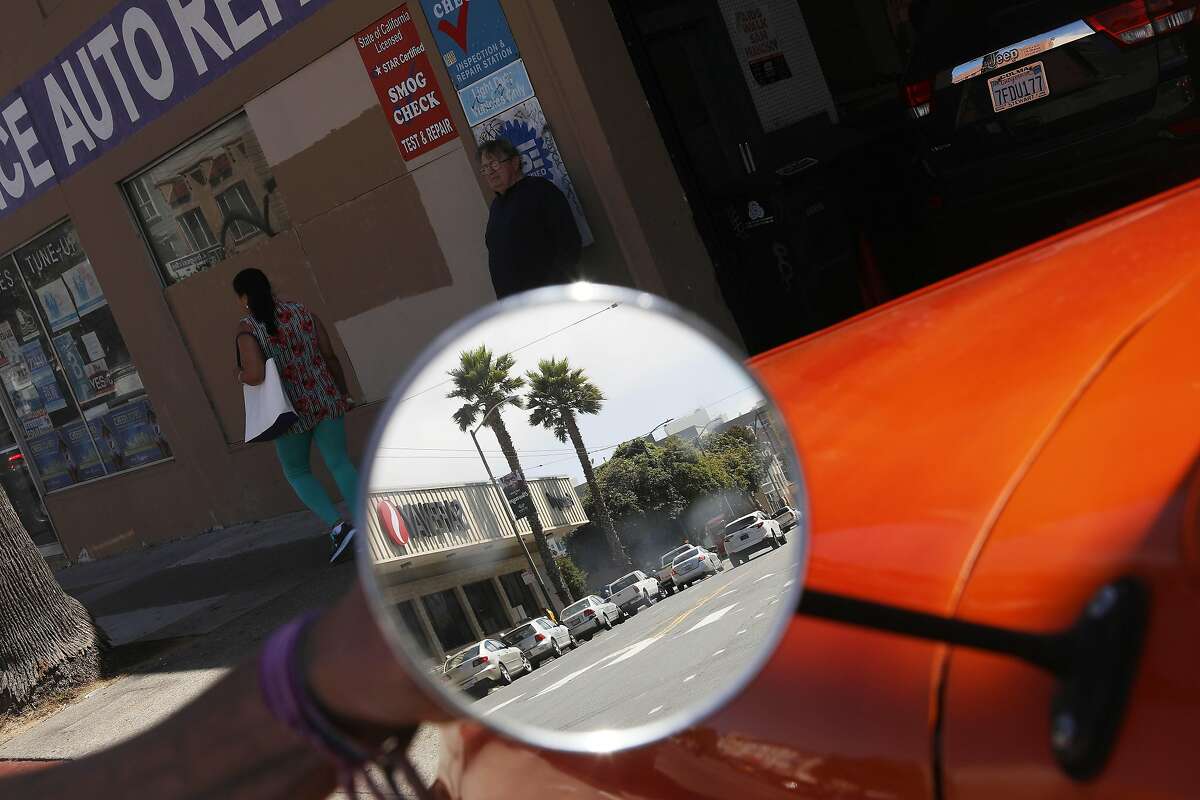 The Safeway at 4950 Mission is reflected in the mirror of Sergio Pina's side mirror of his car on Thursday, September 13, 2018 in San Francisco, Calif.