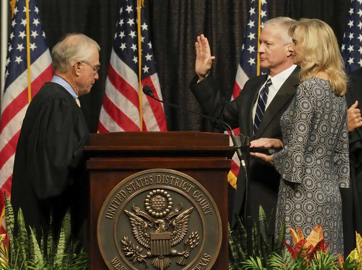 Judge David Counts, United States District Judge Western District of Texas, takes his oath of office from Judge Robert Junell 09/13/18 as his wife, Jill Counts, holds his Bible during his investiture ceremony at the Midland Horseshoe Tim Fischer/Reporter-Telegram