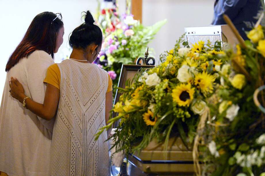 mourners say goodbye during the funeral for caringtin mosley at