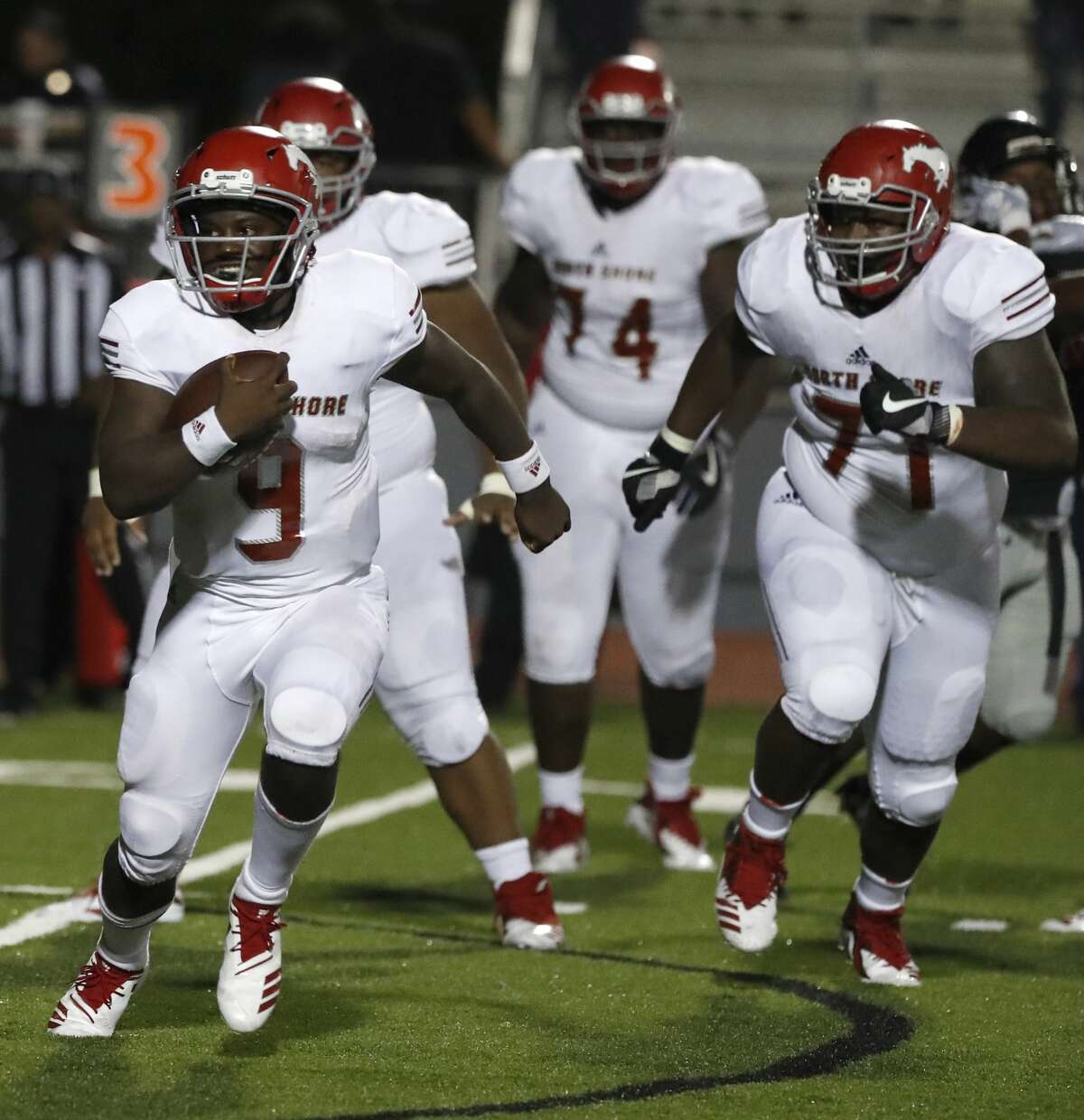 North Shore quarterback Dematrius Davis Jr. (9) runs the ball against Westfield during the second half of a high school football game at Geroge Stadium, Thursday,  September 13, 2018, in Spring.