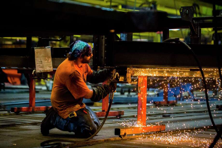 A Load Trail welder works on the frame of a trailer at the manufacturing plant, Thursday, Sept. 6, 2018, in Sumner.  Photo: Marie D. De Jesús, Staff Photographer / © 2018 Houston Chronicle