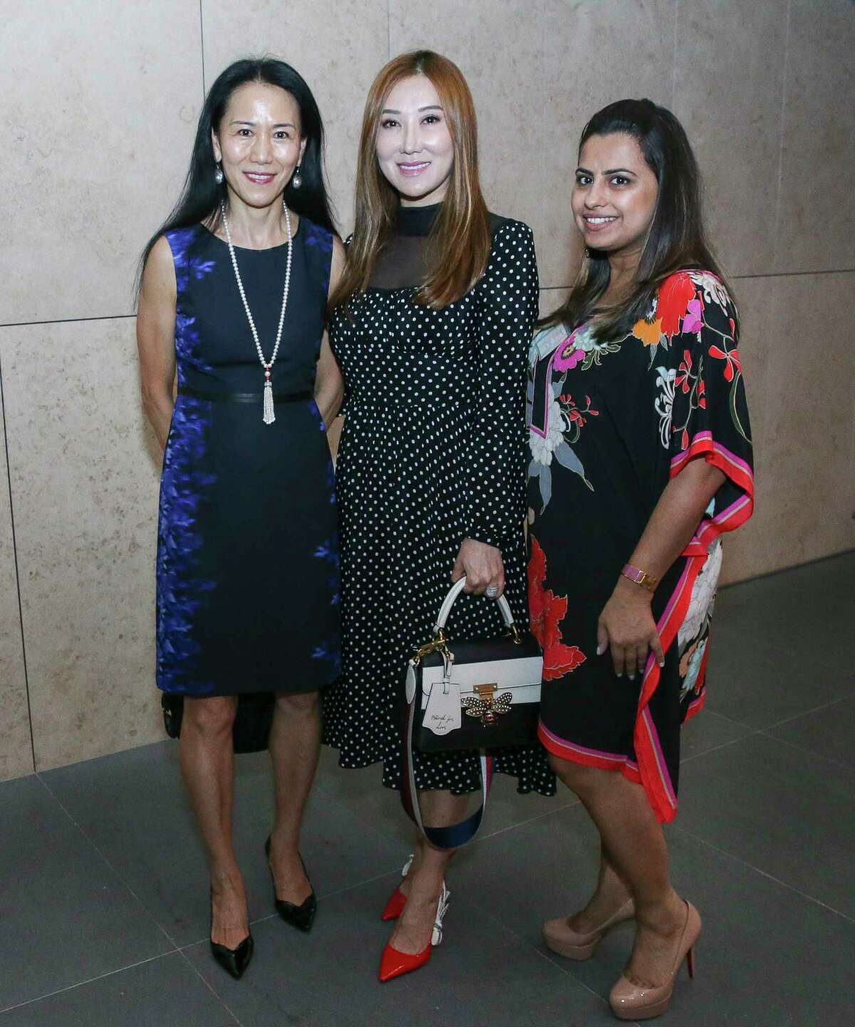 Y. Ping Sun, from left, Mandy Kao and Ruchi Mukherjee pose for a photograph at the Women in Culinary Arts Luncheon at Asia Society Texas Center on Thursday, Sept. 13, 2018, in Houston.