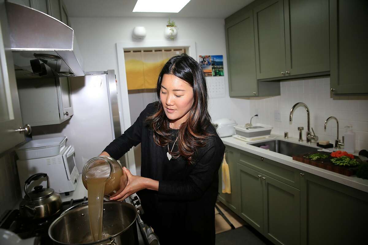 Kristin Eriko Posner makes Tsukune "Matzah Ball" soup in her kitchen on Wednesday, August 22, 2018 in San Francisco, Calif.