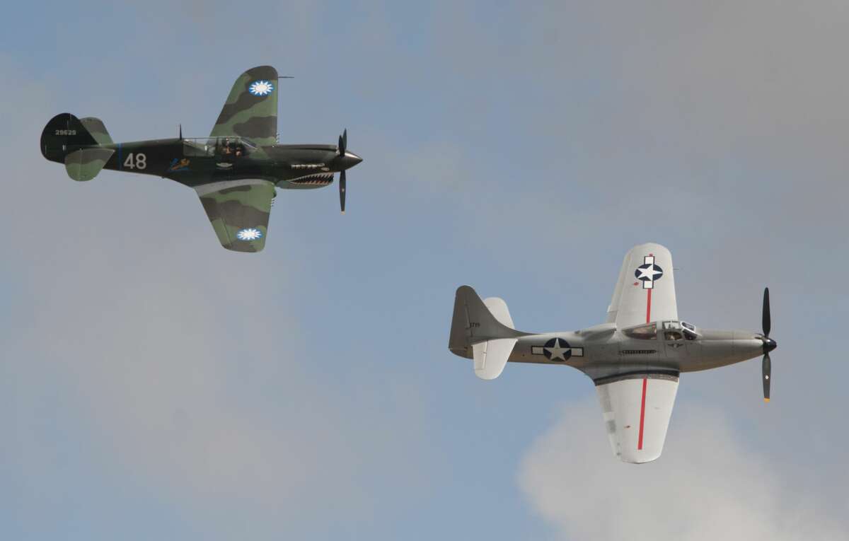 A P-40 Warhawk and a P-63 King Cobra fly in formation 09/14/18 during the Special Air Show for Special People presentation of the High Sky Wing Commenorative Air Force Airsho 2018. Tim Fischer/Reporter-Telegram