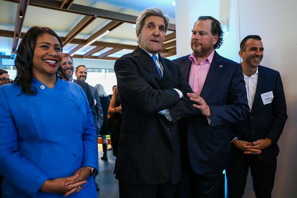 Mayor London Breed (left) laughs while Salesforce CEO Marc Benioff jokes with former Secretary of State John Kerry (center) during the Healthy Oceans Climate Reception at Salesforce East on Mission Street in San Francisco, California, on Thursday, Sept. 13, 2018.