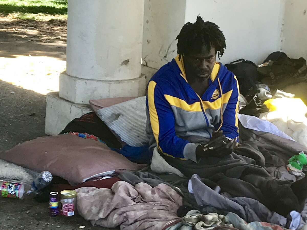 The homeless man identified as Drew has been a regular fixture at Lake Merritt for a couple of years, and gained fame when a jogger tossed his belongings into the water. Oakland officials want to move all the lake's homeless campers into temporary Tuff Shed shelters, but Drew isn't interested.